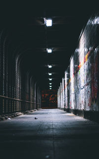 Empty corridor in illuminated building