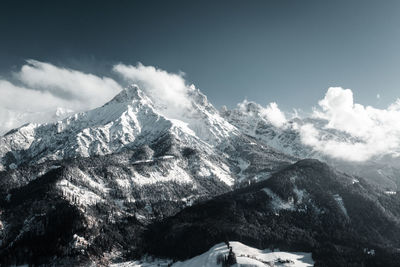 Scenic view of snowcapped mountains against sky