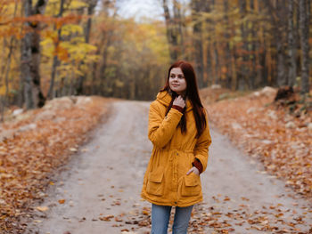 Woman standing in park during autumn