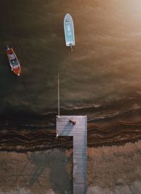 Information sign on beach against sky