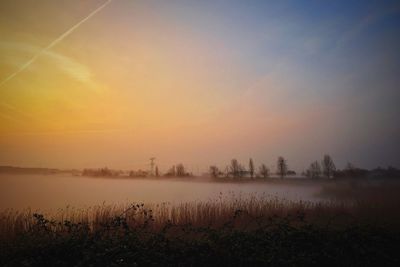 Scenic view of landscape at sunset