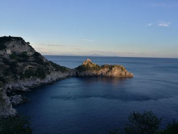 Scenic view of sea against cloudy sky