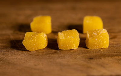 Close-up of yellow candies on table