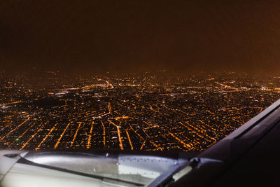 Aerial view of illuminated city at night