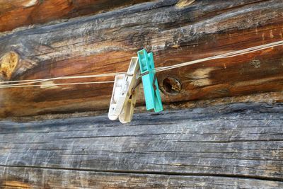 Low angle view of clothes hanging on rope against wall