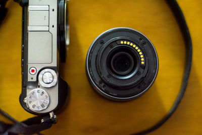 Close-up of camera and lens on table