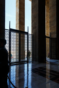 Rear view of man standing outside building