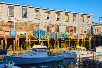 Boats moored at harbor