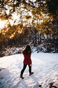 Full length of woman walking on snow