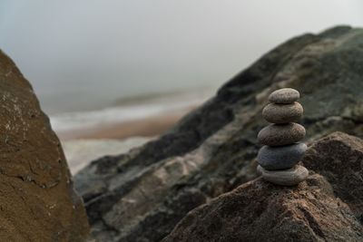 Close-up of stone stack on rock