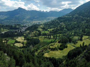 Scenic view of landscape and mountains against sky