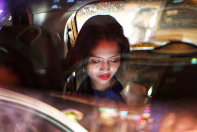 Portrait of young woman using smart phone