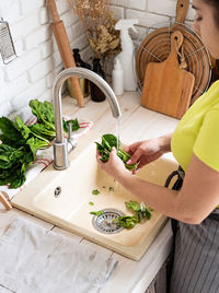 High angle view of woman sitting on table