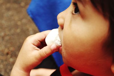 Close-up of boy having food