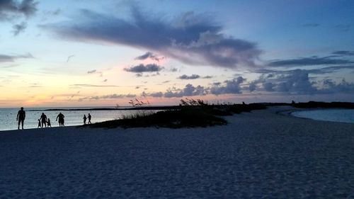 Scenic view of beach against sky during sunset