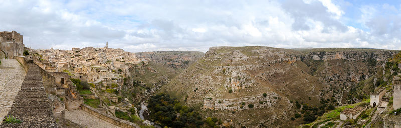 Panoramic view of landscape against cloudy sky