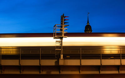 Train at railroad station against sky