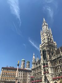 Low angle view of buildings in city against sky