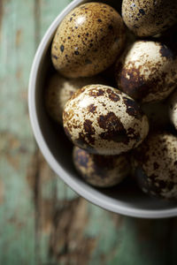 Quail eggs on a wooden table.