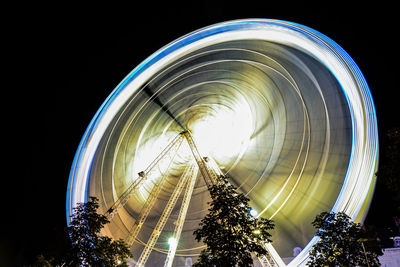 Low angle view of illuminated ferris wheel