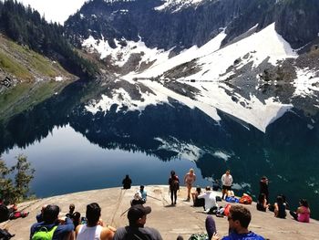 Group of people on snowcapped mountain during winter