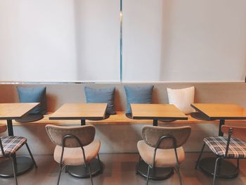 Empty chairs and tables in restaurant