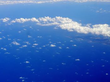 Low angle view of sea against blue sky