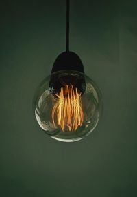 Close-up of illuminated light bulb
