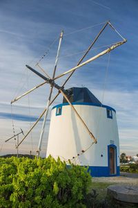 Traditional windmill against sky