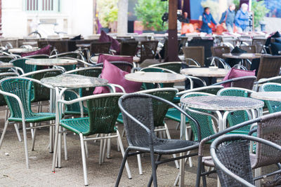 Empty chairs and tables in cafe