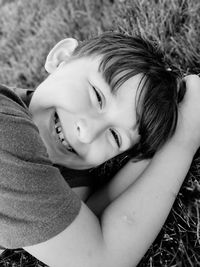 Portrait of smiling girl lying outdoors