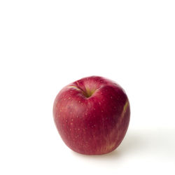 Close-up of apple against white background