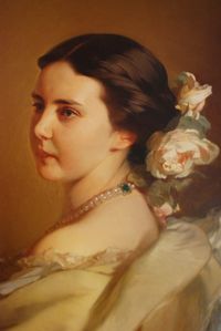 Portrait of beautiful young woman looking away