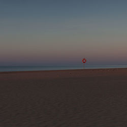 Scenic view of sea against sky at sunset