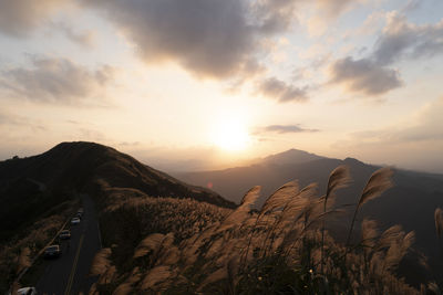 Scenic view of mountains against sky during sunset