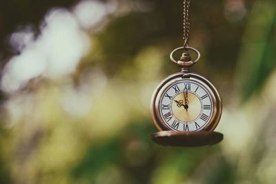 Close-up of clock against blurred background