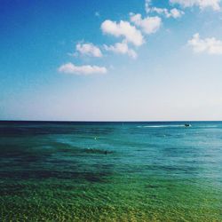 Scenic view of sea against blue sky