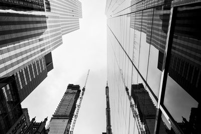 Low angle view of modern buildings in city against sky