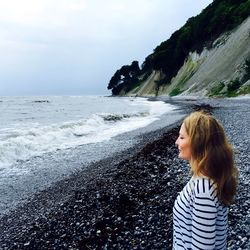 Woman standing on beach