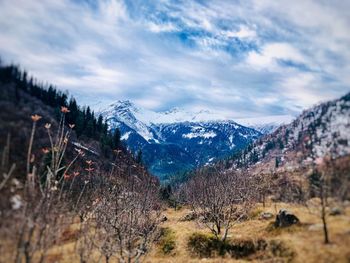 Scenic view of snowcapped mountains against sky