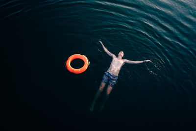 High angle view of man swimming in sea