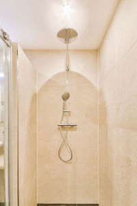 View of shower head on wall in bathroom