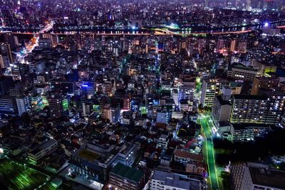 Aerial view of illuminated city at night