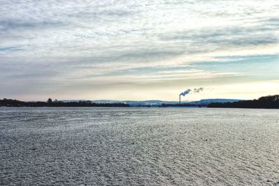 Scenic view of land against sky during winter