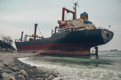 View of ship in sea against sky