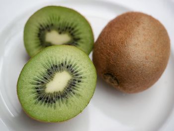 Close-up of fruits in plate on table