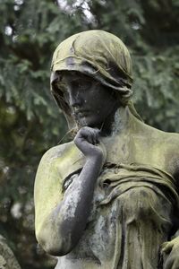 Close-up of statue in cemetery