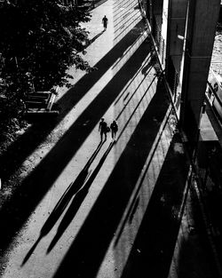 High angle view of people walking on road