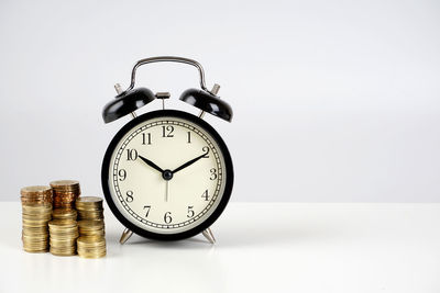 Close-up of clock on table