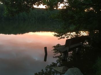 Scenic view of lake against sky at sunset